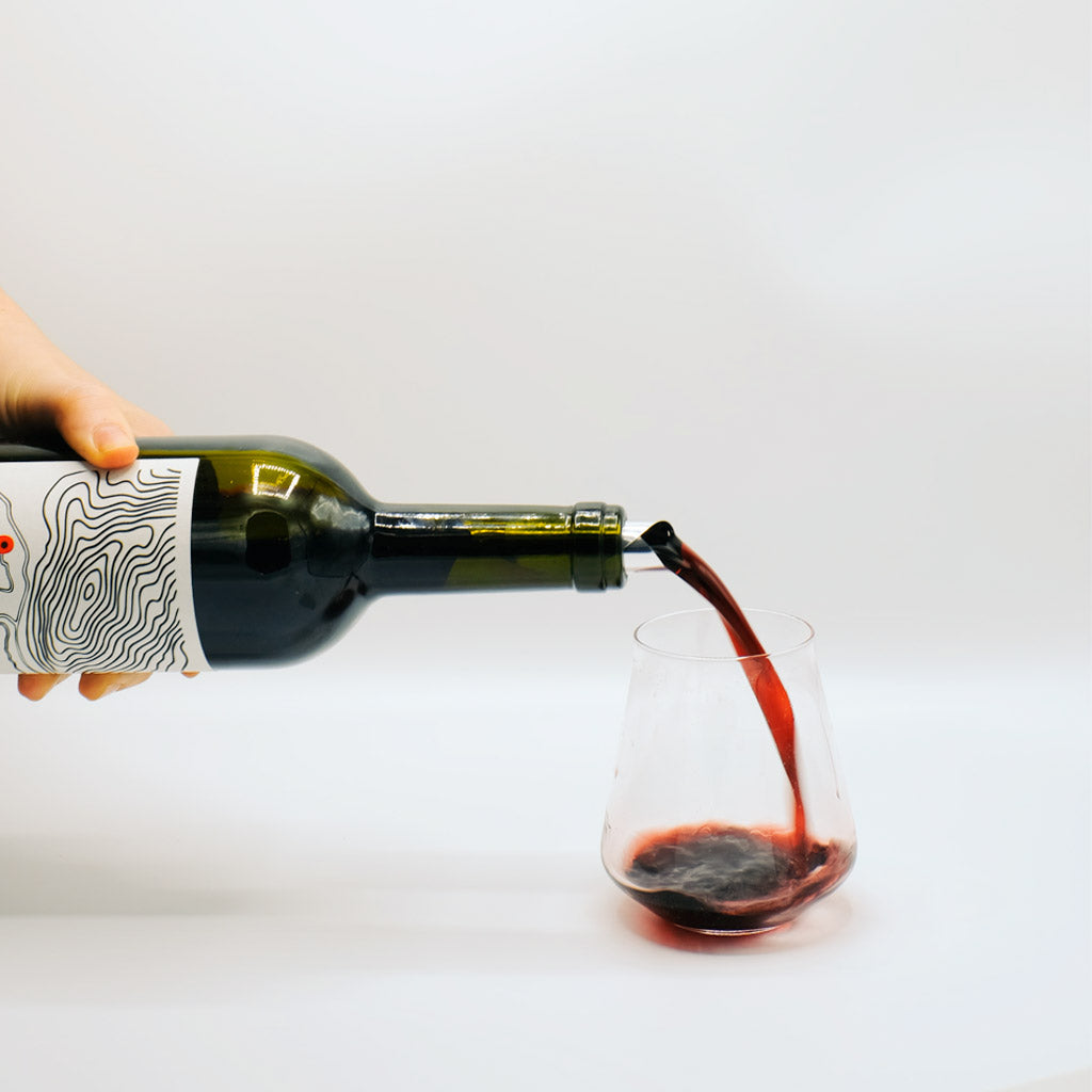 Cantina Berritta Thurcalesu Cannonau Red Wine Bottle pouring into glass, Sardinia, Italy