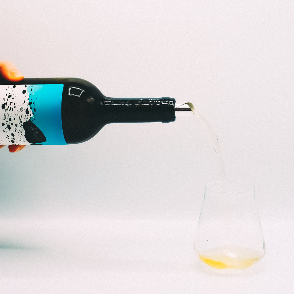 Cantina Berritta Tziu Martine Vermentino White Wine Bottle pouring into glass, Sardinia, Italy