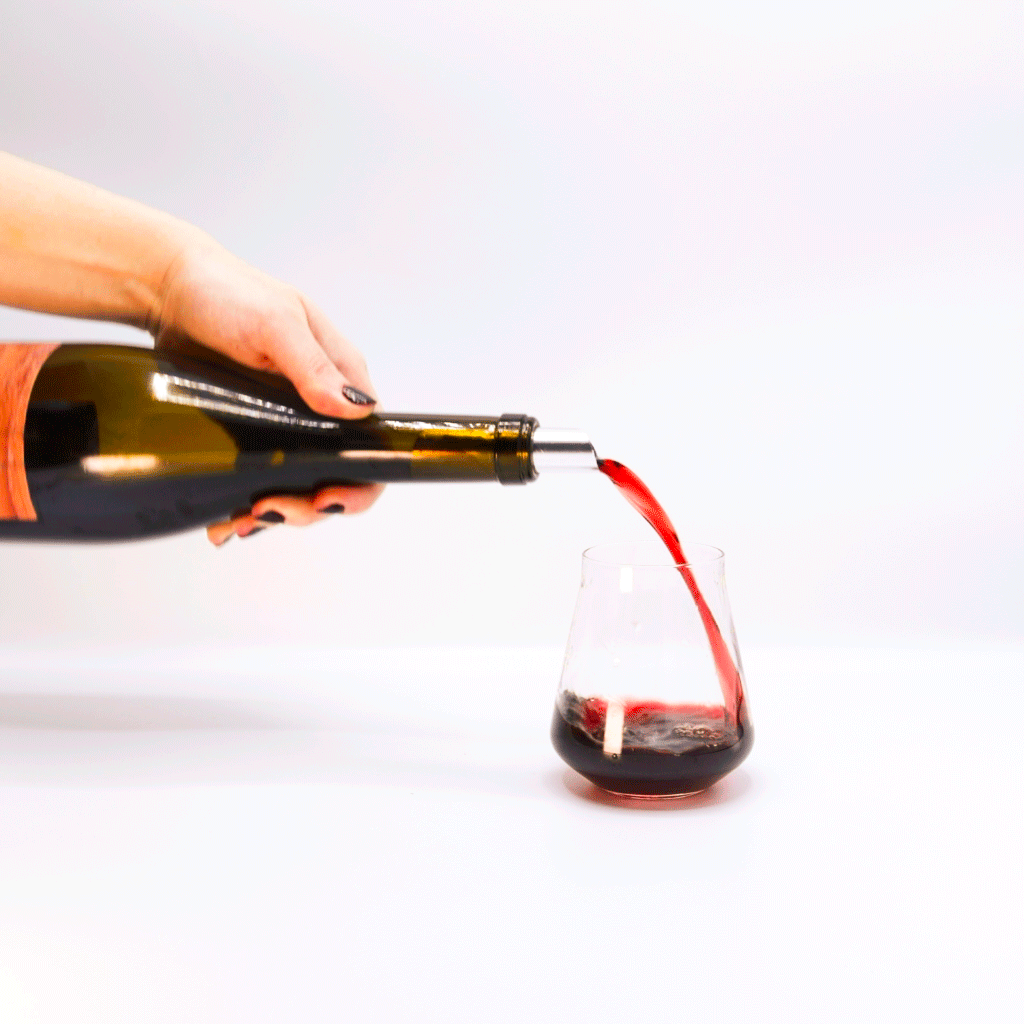 Ottomani Sangiovese Amphora Ferment Red Wine bottle pouring into glass, Tuscany, Italy