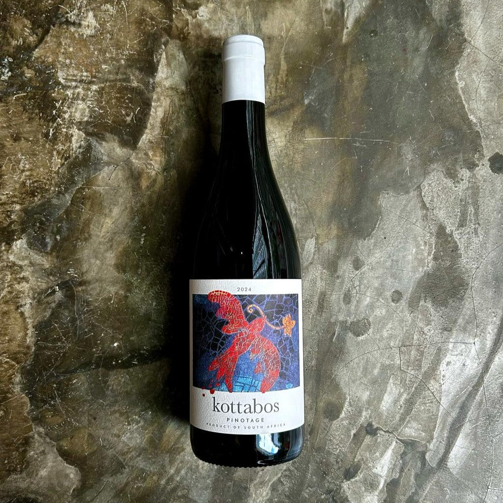Kottabos Pinotage on concrete floor