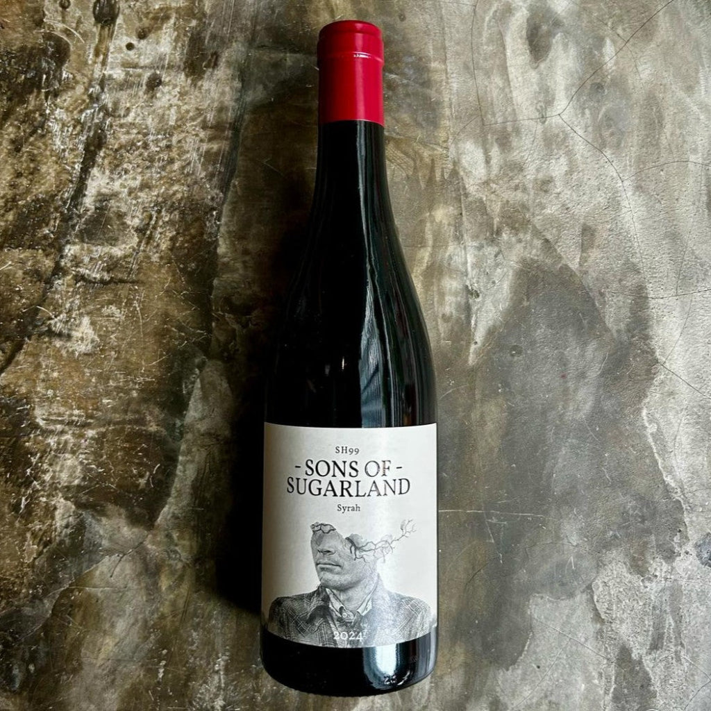 Sons of Sugarland Syrah bottle on concrete floor