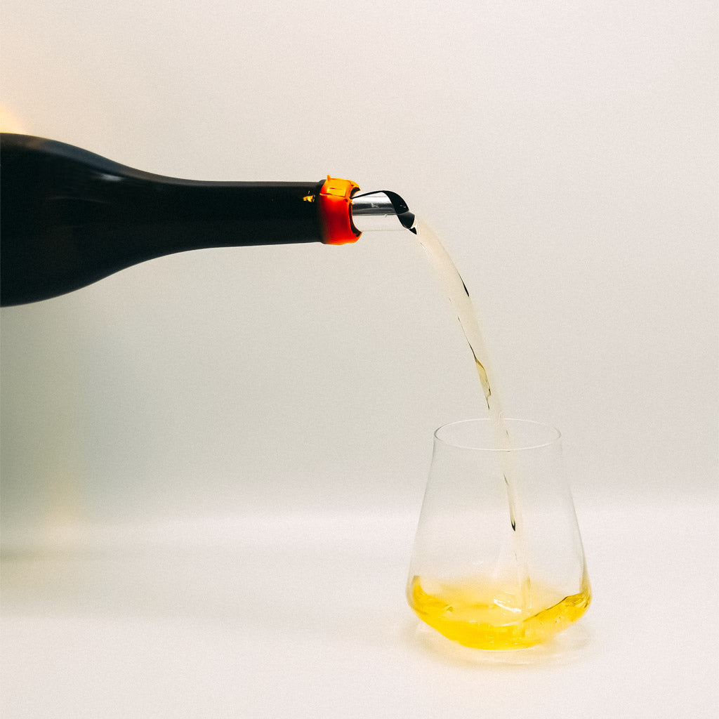 I'm your Huckleberry Semillon, South Africa, orange wine bottle Pouring into glass