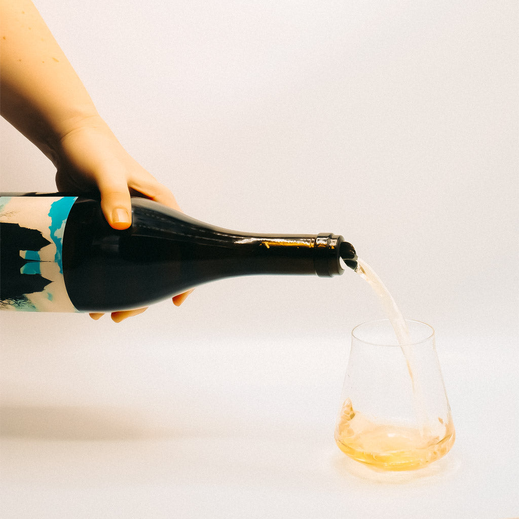Minimus Dijon Free Chardonnay White Wine Bottle pouring into glass, Willamette Valley, Oregon, USA