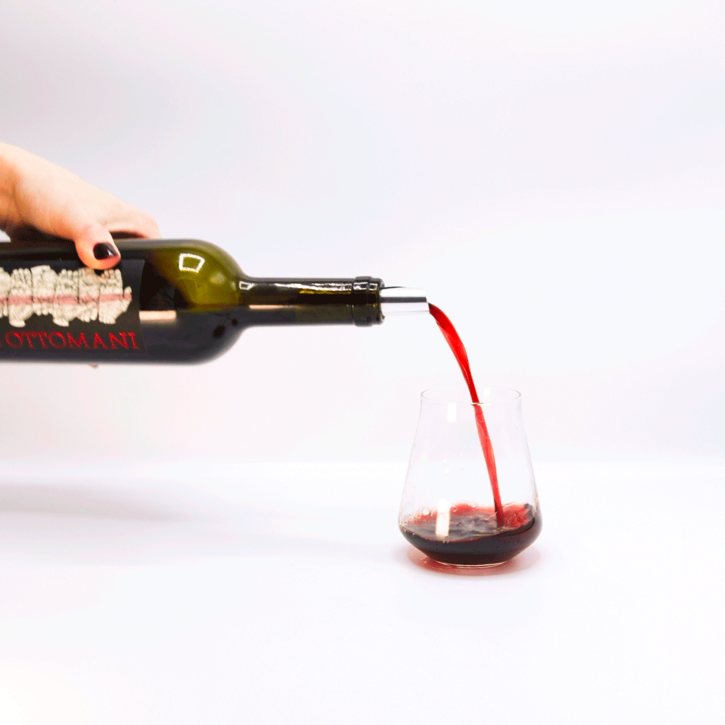 Ottomani Chianti Superiore Red Wine Bottle Pouring into glass