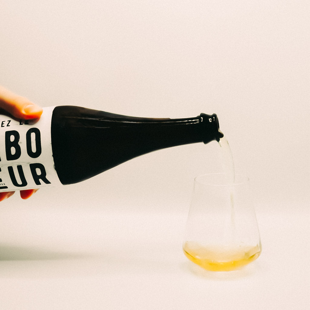 Luddite Saboteur White Wine Bottle pouring into glass, Bot River, South Africa