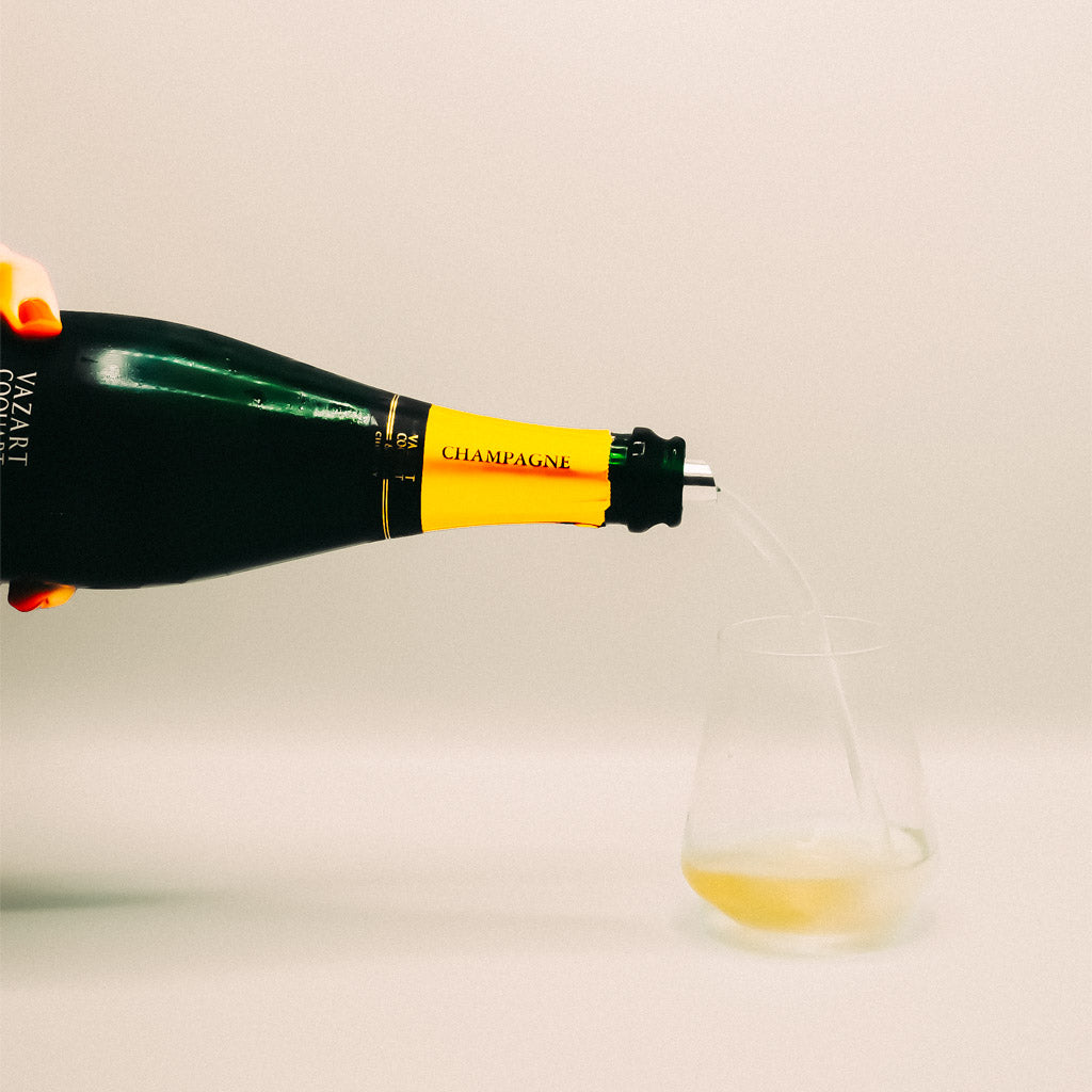 Champagne Vazart-Coquart Bottle pouring into glass, Sparkling Wine, France