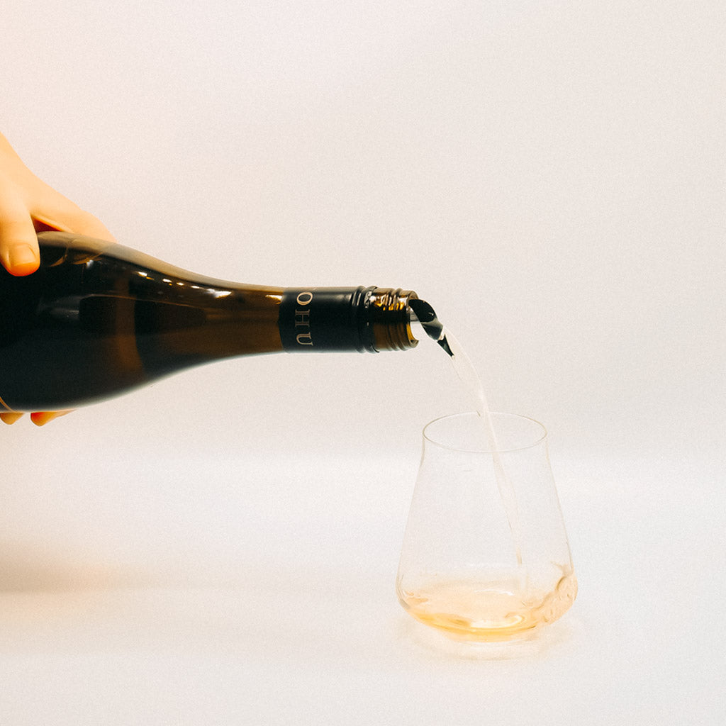Tohu Whenhua Awa Chardonnay White Wine Bottle pouring into glass, Marlborough, New Zealand